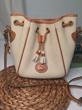 Dooney & Bourke Cream Pebbled Leather Drawstring Bucket Bag with Tan Trim